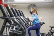 Ellenor Sell works out wearing her mask on the first day of Campus Recreation re-opening after being
