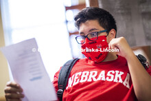 PJ Miguelino studies in a University Suites Residence Hall room. Photo shoot of students wearing mas