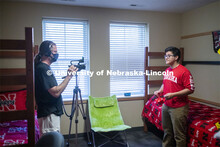 PJ Miguelino helps make a video of how to wear a mask. Photo shoot of students wearing masks and pra