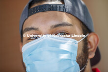 Aldi Airori wears a mask. Photo shoot of students wearing masks and practicing social distancing. Ju