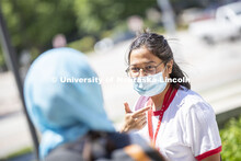 Sandhya Karki wears a mask while talking with a friend. Photo shoot of students wearing masks and pr
