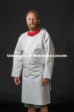 Jerry Reif, shop manager at Nebraska Innovation Studio, wears a PPE gown designed at manufactured at
