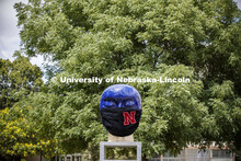 Untitled by Jun Kaneko in the Sheldon Sculpture Garden wearing a photoshopped mask. The sculpture is