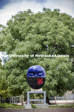 Untitled by Jun Kaneko in the Sheldon Sculpture Garden wearing a photoshopped mask. The sculpture is