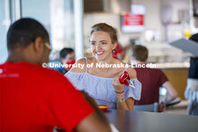 Students eating in the Willa Cather Dining Center. Photo shoot of students wearing masks and practic