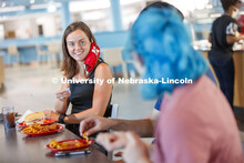 Students eating in the Willa Cather Dining Center. Photo shoot of students wearing masks and practic