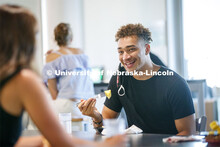 Students eating in the Willa Cather Dining Center. Photo shoot of students wearing masks and practic