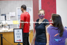 Students waiting in line at the Willa Cather Dining Center. Photo shoot of students wearing masks an