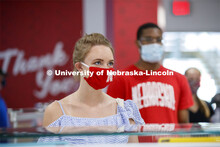 Students standing in line at the Willa Cather Dining Center wearing masks. Photo shoot of students w