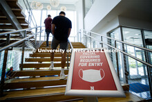 A sign by the stairwell in the Willa Cather complex tells students to wear masks upon. Photo shoot o