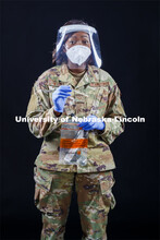 Senior Airman Tamara Silcott of the Nebraska Air National Guard wears a face shield made at Nebraska