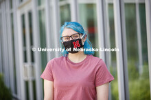 Atley Van Emmerik, a sophomore in dance from Glenvil, Nebraska wears a Husker mask. Photo shoot of s