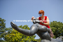 Stacey Walsh, the Sheldon Museum of Associate Registrar for Collections and Exhibitions, rids Floati