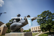 Floating Figure, a sculpture by Gaston Lachaise, is one of many UNL campus sculptures wearing masks.