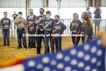 Participants in the sheep show at the Platte County Fair in Columbus, NE, pledge allegiance to the f