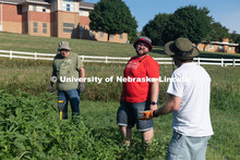 Extension Educator, John porter (in red), is part of the Urban Agriculture Program Coordinator. Mast