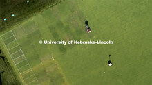 Craig Ferguson, ag research technician, cuts the grass on the turf grass test plots on east campus. 