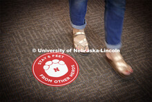 Stickers with elephant feet help patrons keep social distancing in the museum. The Nebraska State Mu