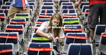 Maddie Huppert, student worker for the Executive Vice Chancellor’s office, wraps an available seat