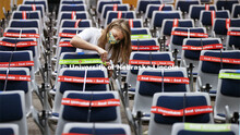 Maddie Huppert, student worker for the Executive Vice Chancellor’s office, wraps an available seat
