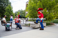 Photo shoot of students with Herbie on city campus display mask wearing, social distancing. Students