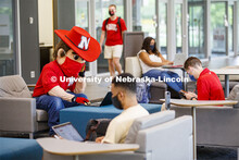 Photo shoot of students with Herbie on city campus display mask wearing, social distancing. Herbie a