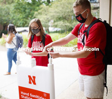 Photo shoot of students display mask wearing and hand sanitizing. Students at a hand sanitizing stat