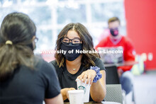 Photo shoot of students on city campus display mask wearing, social distancing. Students wearing mas