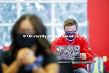 Photo shoot of students on city campus display mask wearing, social distancing. Students wearing mas