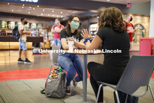 Photo shoot of students on city campus display mask wearing, social distancing. Students wearing mas