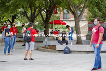 Photo shoot of students on city campus display mask wearing and social distancing. Students wear mas