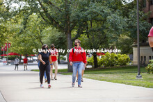 Photo shoot of students on city campus display mask wearing and social distancing. Students wearing 