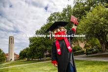 Herbie Husker has a protective mask on while he poses in front of the Mueller Bell tower while weari