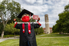 Herbie Husker has a protective mask on while he poses in front of the Mueller Bell tower while weari