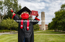 Herbie Husker has a protective mask on while he poses in front of the Mueller Bell tower while weari