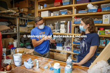 Eddie Dominguez, Professor of Art, works with Kinga Aletto. Aletto, a junior in College of Agricultu
