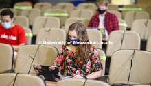Masked students in an Anderson Hall Lecture Hall are seated for social distancing. Photo shoot of st