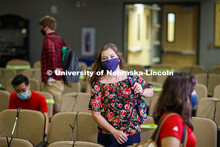 Masked students in an Anderson Hall Lecture Hall are seated for social distancing. Photo shoot of st