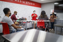 Students wear masks as they study in the Lynn and Dana Roper Media Studio in Anderson Hall. Photo sh