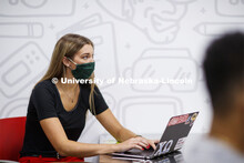 Students wear masks as they study in the Lynn and Dana Roper Media Studio in Anderson Hall. Photo sh