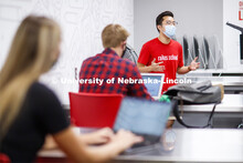 Students wear masks as they study in the Lynn and Dana Roper Media Studio in Anderson Hall. Photo sh