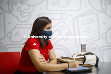 Students wear masks as they study in the Lynn and Dana Roper Media Studio in Anderson Hall. Photo sh