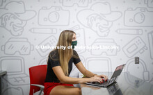 Students wear masks as they study in the Lynn and Dana Roper Media Studio in Anderson Hall. Photo sh