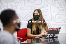 Students wear masks as they study in the Lynn and Dana Roper Media Studio in Anderson Hall. Photo sh