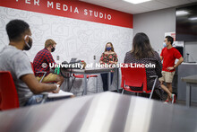 Students wear masks as they study in the Lynn and Dana Roper Media Studio in Anderson Hall. Photo sh
