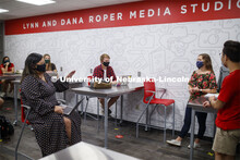 Students wear masks as they study in the Lynn and Dana Roper Media Studio in Anderson Hall. Photo sh