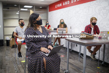 Students wear masks as they study in the Lynn and Dana Roper Media Studio in Anderson Hall. Photo sh