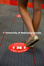 Social distancing stickers are placed on the floors to remind students to keep a distance of six fee