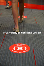 Social distancing stickers are placed on the floors to remind students to keep a distance of six fee