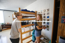 Miqaela Davis, right, from Omaha, smiles at her mom, Monica, after finishing decorating one of her w